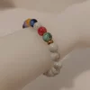 bb100133 Armbånd med farvede sten 8mm